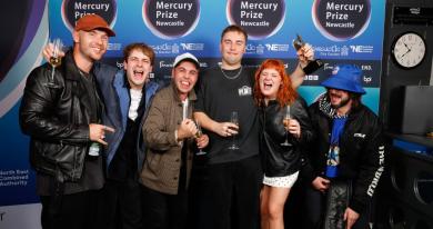 Sam Fender and his band with their 2025 Mercury Prize award