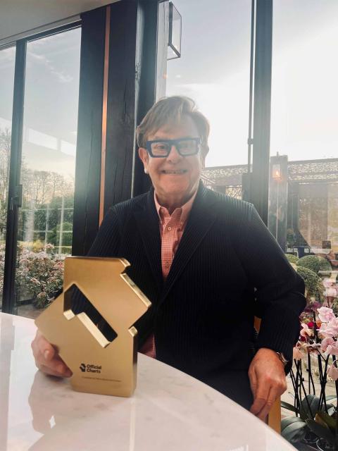 Elton John with his Number 1 album award for Diamonds