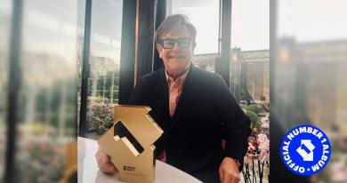 Elton John with his Number 1 album award for Diamonds